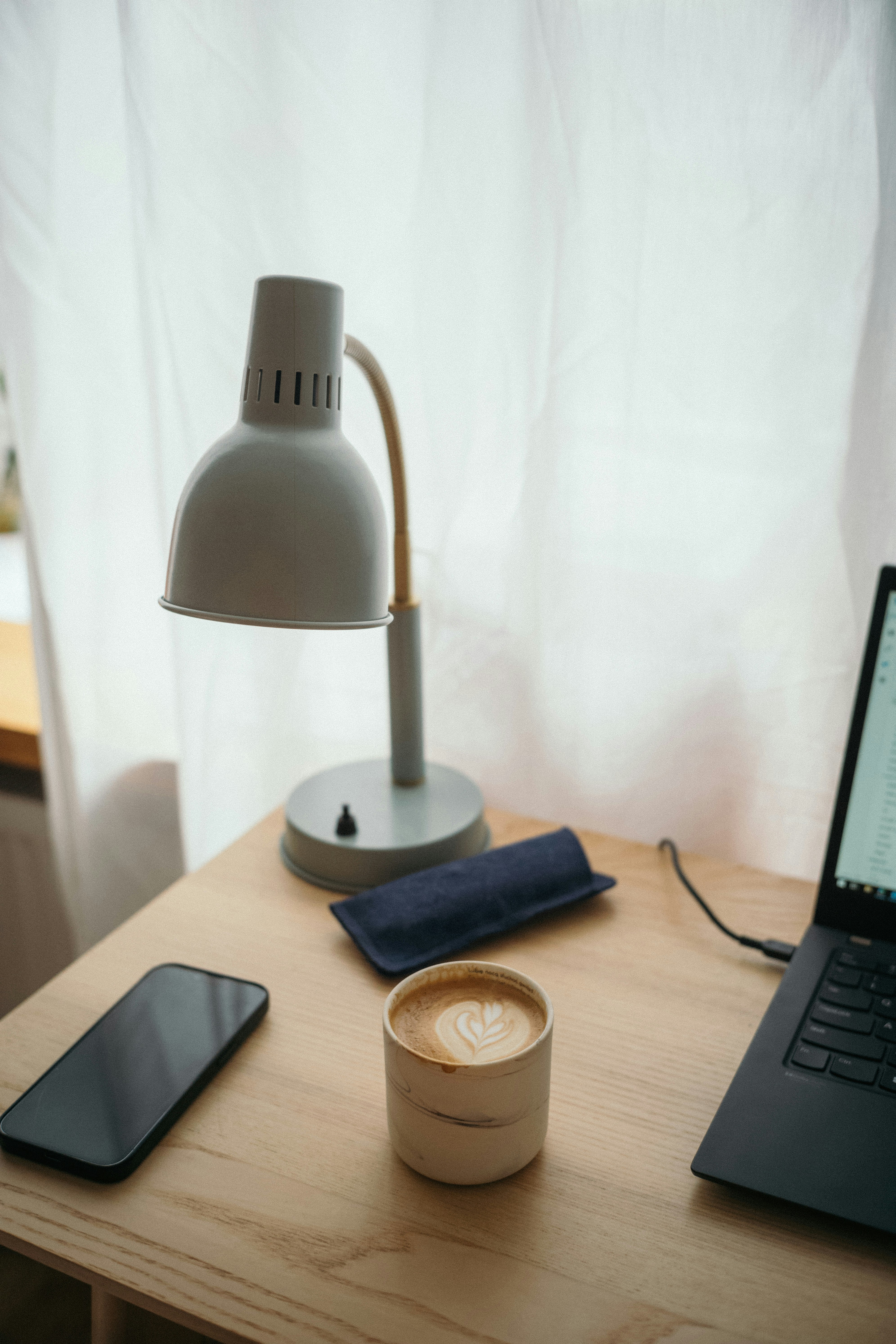 A calm workspace with coffee and a laptop